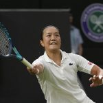 
              France's Harmony Tan returns to Serena Williams of the US in a first round women's singles match on day two of the Wimbledon tennis championships in London, Tuesday, June 28, 2022. (AP Photo/Alberto Pezzali)
            