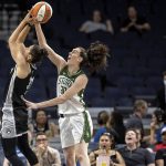 Minnesota Lynx's Nikolina Milic (31) is fouled by Seattle Storm's Breanna Stewart (30) during the first quarter of a WNBA basketball game Tuesday, June 14, 2022, in Minneapolis. (Carlos Gonzalez/Star Tribune via AP)
