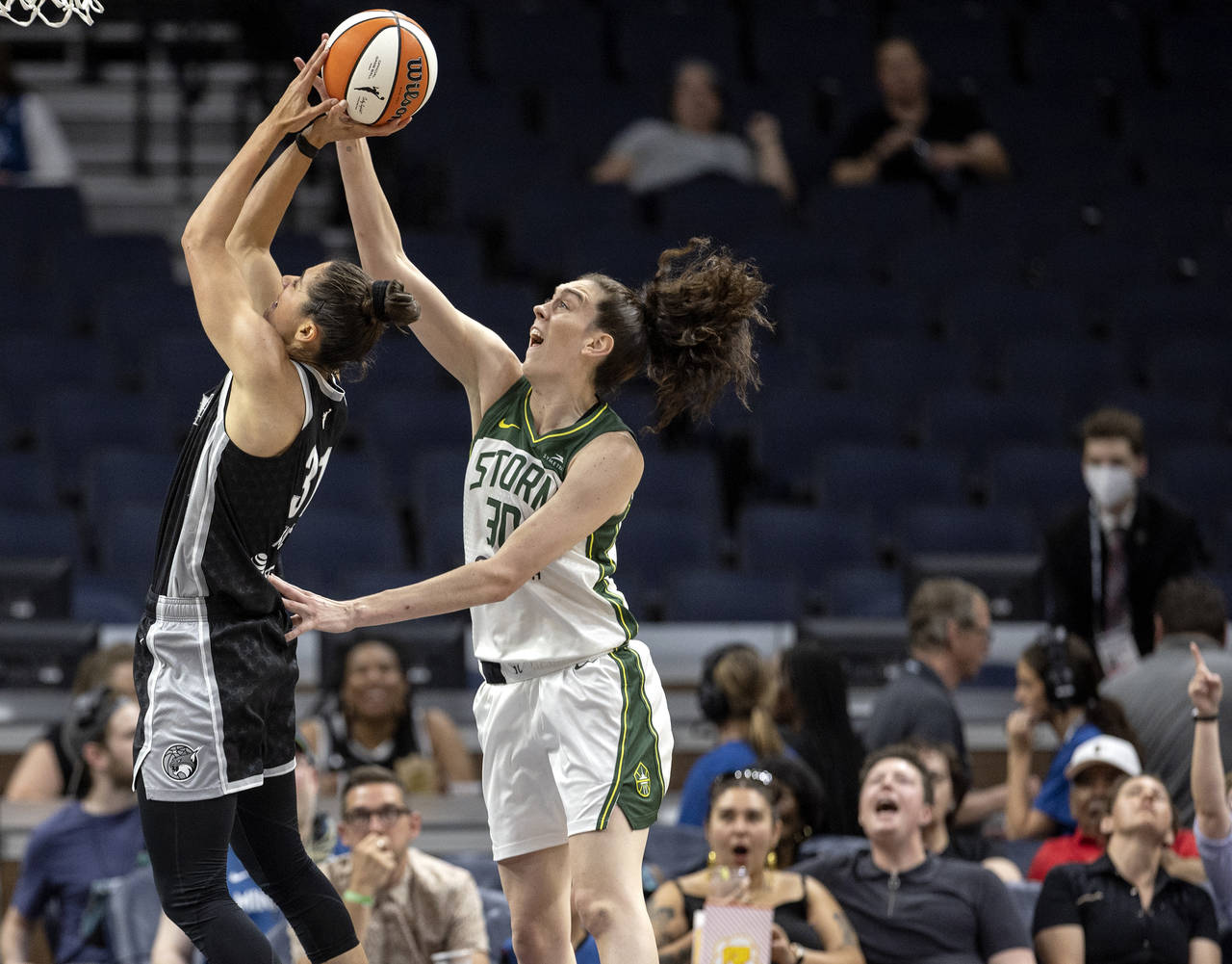Minnesota Lynx's Nikolina Milic (31) is fouled by Seattle Storm's Breanna Stewart (30) during the f...