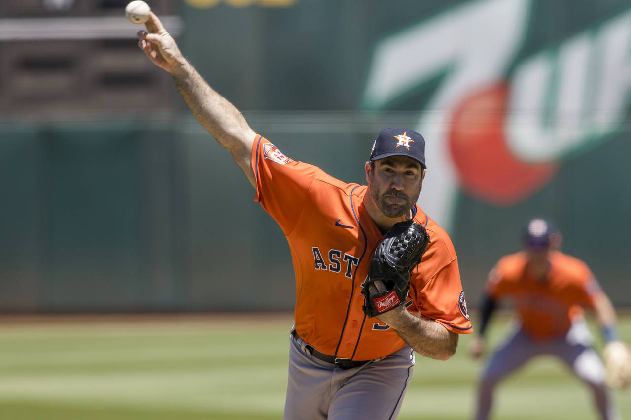 Houston Astros' Justin Verlander pitches against an Oakland Athletics batter during the first innin...
