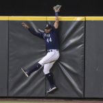 
              Seattle Mariners centerfielder Julio Rodriguez hits the outfield wall after failing to catch a home run ball hit by Baltimore Orioles' Jorge Mateo during the sixth inning of a baseball game, Monday, June 27, 2022, in Seattle. (AP Photo/Stephen Brashear)
            