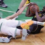 
              Golden State Warriors' Draymond Green, 23, fights for the ball with Boston Celtics' Jayson Tatum, 0, during the fourth quarter of Game 4 of basketball's NBA Finals, in Boston, Mass., on Friday, June 10, 2022. (Carlos Avila Gonzalez/San Francisco Chronicle via AP)
            