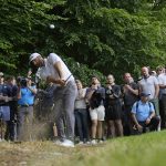 
              Dustin Johnson of the United States plays from the rough during the first round of the inaugural LIV Golf Invitational at the Centurion Club in St. Albans, England, Thursday, June 9, 2022. (AP Photo/Alastair Grant)
            