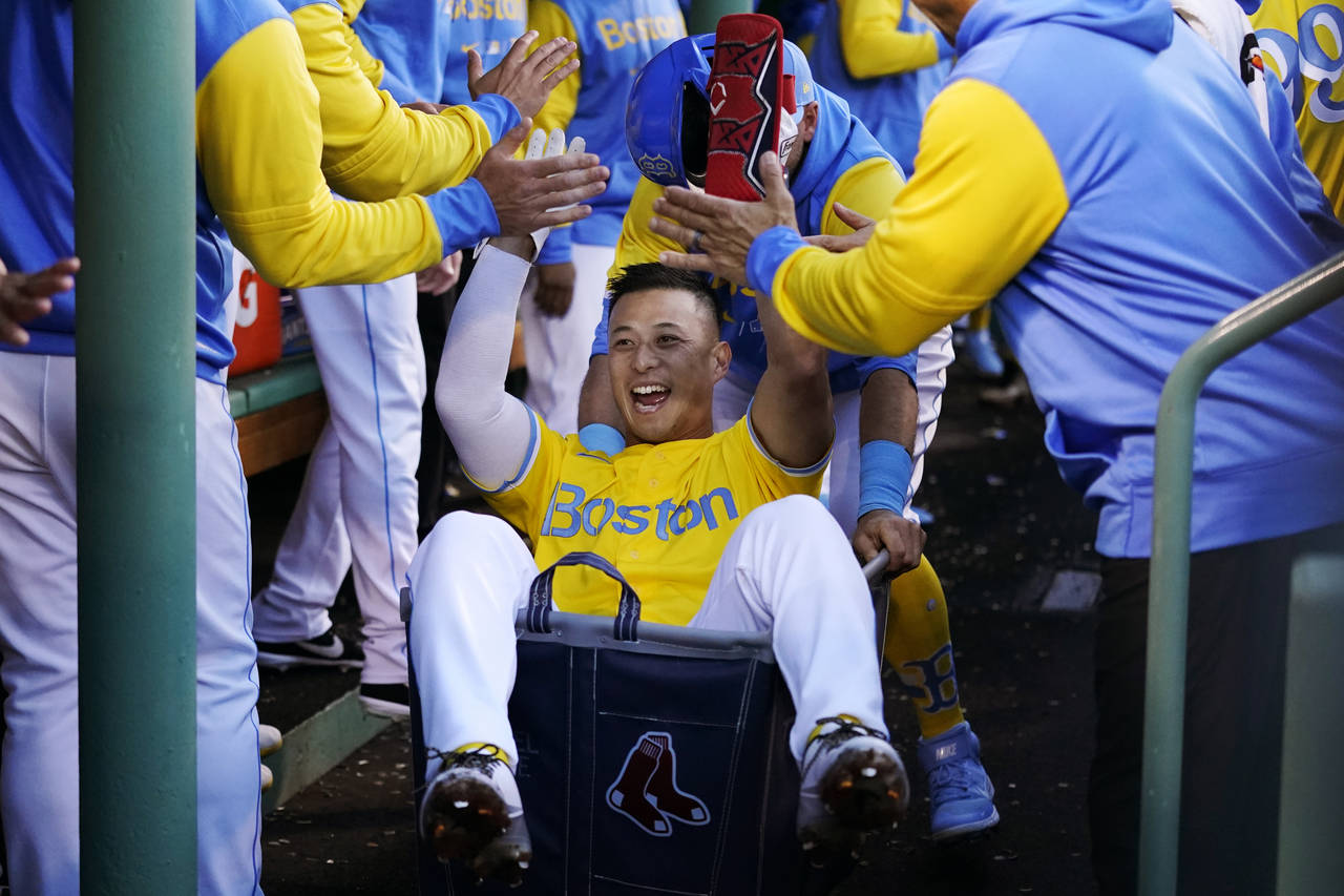 Boston Red Sox's Rob Refsnyder celebrates after his two run home run during the third inning of a b...