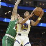 
              CORRECTS TO GAME 2 INSTEAD OF GAME 1 - Golden State Warriors guard Jordan Poole (3) shoots against Boston Celtics center Daniel Theis during the second half of Game 2 of basketball's NBA Finals in San Francisco, Sunday, June 5, 2022. (AP Photo/Jed Jacobsohn)
            