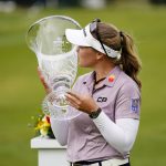 
              Brooke M. Henderson, of Canada, kisses the trophy after winning the ShopRite LPGA Classic golf tournament, Sunday, June 12, 2022, in Galloway, N.J. (AP Photo/Matt Rourke)
            