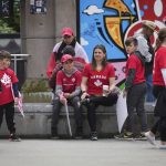 
              Fans wait outside B.C. Place stadium after the Canadian national men's soccer team's friendly match against Panama was canceled due to a labor dispute, in Vancouver, British Columbia, Sunday, June 5, 2022. (Darryl Dyck/The Canadian Press via AP)
            