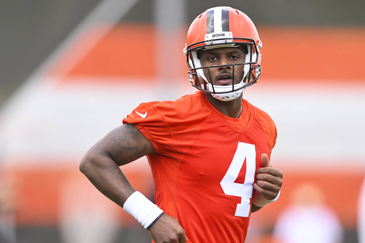 Cleveland Browns quarterback Deshaun Watson runs on the field during an NFL football practice at th...