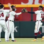 
              Atlanta Braves outfielders from left; Adam Duvall (14), Marcell Ozuna (2) and Ronald Acuna Jr. (13) celebrate after defeating the Pittsburgh Pirates in a baseball game Thursday ,June 9, 2022, in Atlanta. (AP Photo/John Bazemore)
            