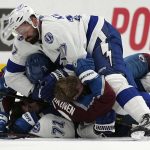 
              Players from the Colorado Avalanche and the Tampa Bay Lightning fight during the third period in Game 2 of the NHL hockey Stanley Cup Final Saturday, June 18, 2022, in Denver. Among the players are Lightning's Alex Killorn (17) and Anthony Cirelli (71) and Avalanche's Artturi Lehkonen. (AP Photo/John Locher)
            