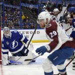 
              Colorado Avalanche center Nathan MacKinnon (29) skates away after scoring on Tampa Bay Lightning goaltender Andrei Vasilevskiy (88) during the second period of Game 6 of the NHL hockey Stanley Cup Finals on Sunday, June 26, 2022, in Tampa, Fla. (AP Photo/Phelan Ebenhack)
            
