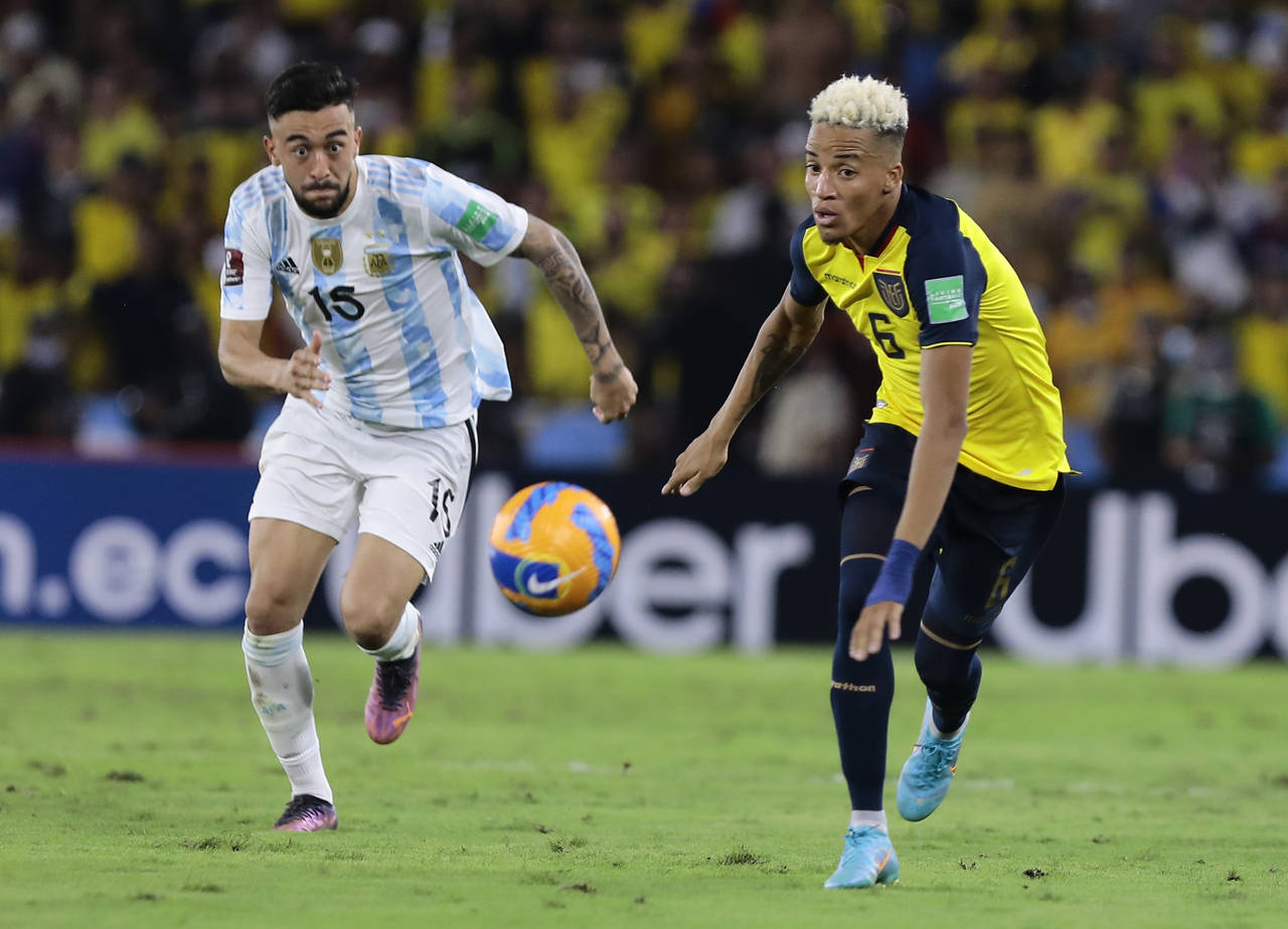 FILE - Ecuador's Byron Castillo, right, and Argentina's Nicolas Gonzalez eye the ball during a qual...