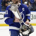 
              Tampa Bay Lightning center Steven Stamkos holds the Prince of Wales Trophy after defeating the New York Rangers during Game 6 of the NHL hockey Stanley Cup playoffs Eastern Conference finals Saturday, June 11, 2022, in Tampa, Fla. The Lightning advanced to the Stanley Cup Finals. (AP Photo/Chris O'Meara)
            