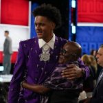 
              Paolo Banchero talks with friends and family before the start of the NBA basketball draft, Thursday, June 23, 2022, in New York. (AP Photo/John Minchillo)
            