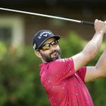 
              Adam Hadwin watches his tee shot on the 13th hole during the second round of the Canadian Open golf tournament at St. George's on Friday, June 10, 2022, in Toronto. (Nathan Denette/The Canadian Press via AP)
            