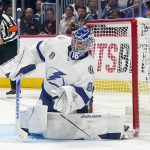 
              Tampa Bay Lightning goaltender Andrei Vasilevskiy reaches for the puck during the third period of Game 1 of the team's NHL hockey Stanley Cup Final against the Colorado Avalanche on Wednesday, June 15, 2022, in Denver. (AP Photo/John Locher)
            