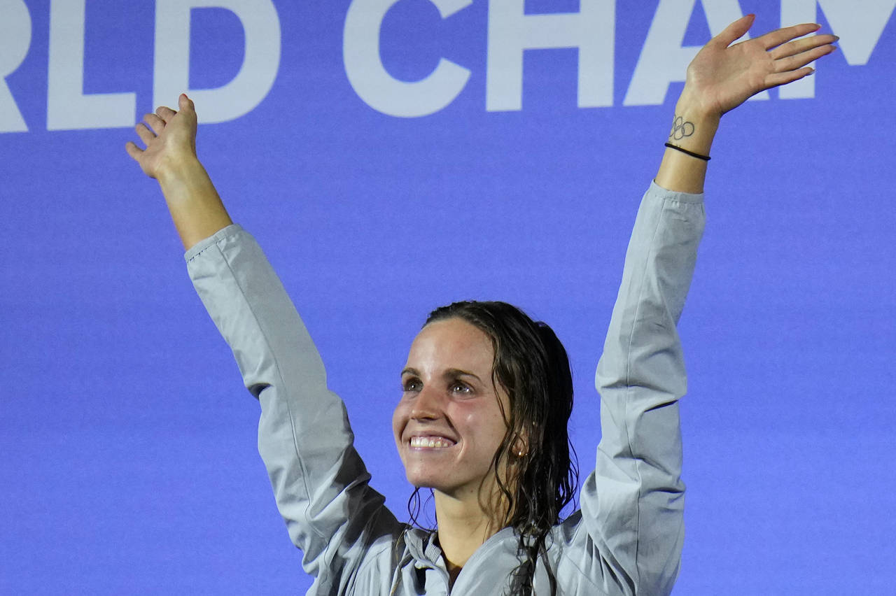 Regan Smith of the United States waves from the podium after winning the Women 100m Backstroke fina...