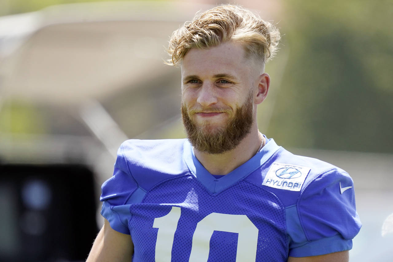 Los Angeles Rams wide receiver Cooper Kupp smiles during stretching at the NFL football team's prac...
