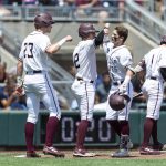 
              Texas A&M Jordan Thompson, third from left, celebrates his three-run home run with teammates Brett Minnich (23) and Troy Claunch (12) in the second inning against Oklahoma in the during an NCAA College World Series baseball game Friday, June 17, 2022, in Omaha, Neb. (AP Photo/John Peterson)
            
