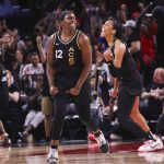 
              Las Vegas Aces guard Chelsea Gray (12) and forward A'ja Wilson celebrate after a play against the Minnesota Lynx during the second half of a WNBA basketball game Sunday, June 19, 2022, in Las Vegas. (Chase Stevens/Las Vegas Review-Journal via AP)
            