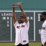 
              Former Boston Red Sox's Manny Ramirez, left, displays his Boston Red Sox Hall of Fame plaque during a pre-game ceremony as former teammate David Ortiz, right, looks on before a baseball game against the Detroit Tigers, Monday, June 20, 2022, in Boston. (AP Photo/Steven Senne)
            