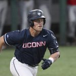 
              UConn's Ben Huber runs to first against Maryland during the NCAA Division 1 regional playoff baseball tournament game, Saturday, June 4, 2022 in College Park, Md. (AP Photo/Gail Burton)
            