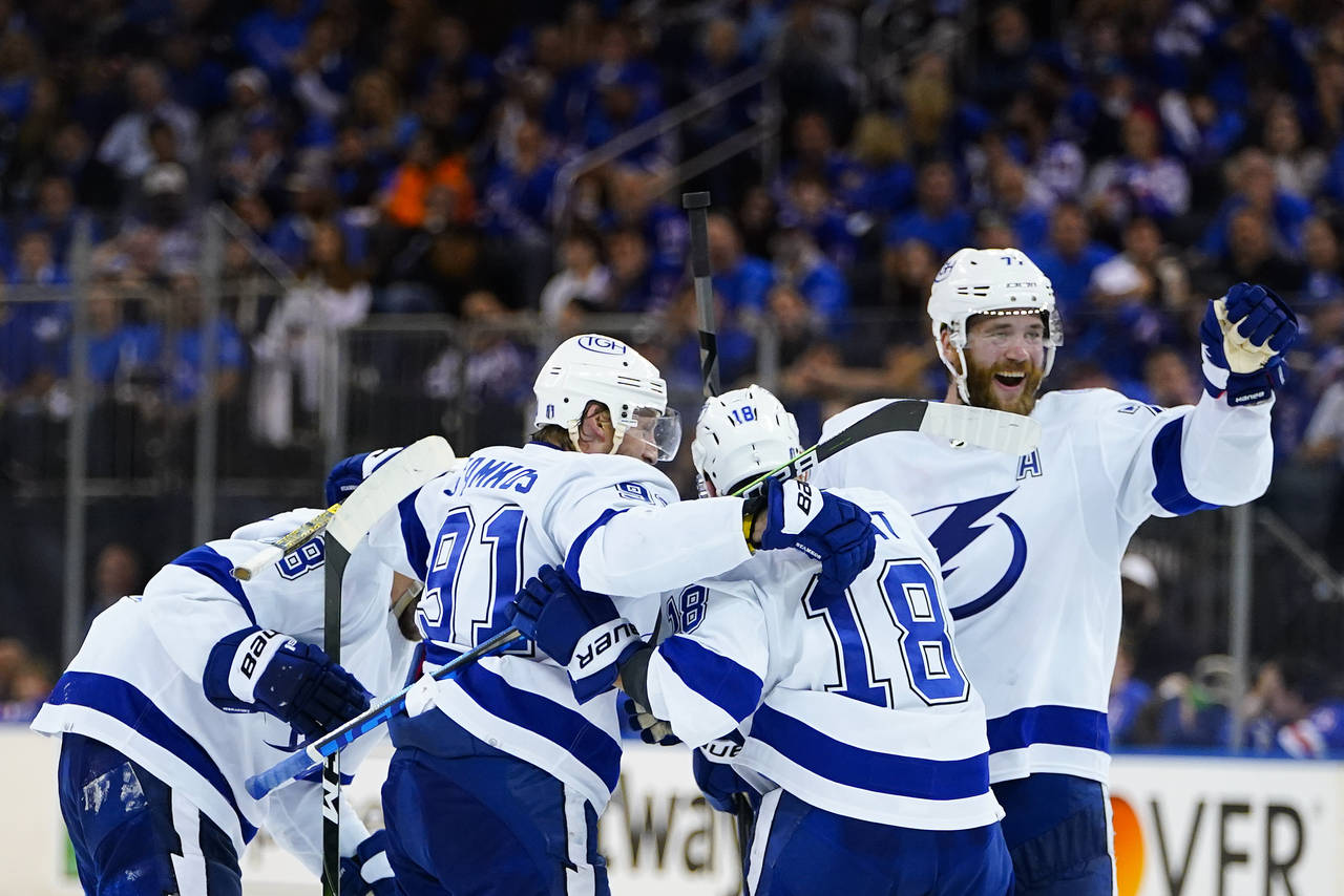 The Tampa Bay Lightning celebrate a goal during the third period against the New York Rangers in Ga...