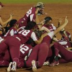 
              Oklahoma players celebrate after defeating Texas in the NCAA Women's College World Series softball finals Thursday, June 9, 2022, in Oklahoma City. (AP Photo/Sue Ogrocki)
            