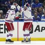 
              New York Rangers left wing Chris Kreider (20) celebrates his goal against the Tampa Bay Lightning with center Mika Zibanejad (93) during the second period in Game 3 of the NHL hockey Stanley Cup playoffs Eastern Conference finals Sunday, June 5, 2022, in Tampa, Fla. (AP Photo/Chris O'Meara)
            