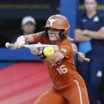
              Texas' Alyssa Popelka (16) bunts against Arizona during the fifth inning of an NCAA softball Women's College World Series game on Sunday, June 5, 2022, in Oklahoma City. (AP Photo/Alonzo Adams)
            