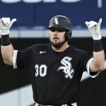 
              Chicago White Sox's Jake Burger gestures to the dugout after hitting a double against the Toronto Blue Jays during the fourth inning of a baseball game Wednesday, June 1, 2022, in Toronto. (Jon Blacker/The Canadian Press via AP)
            