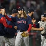 
              Boston Red Sox relief pitcher Matt Strahm, center, celebrates with teammates after a 6-5 win over the Los Angeles Angels in a baseball game in Anaheim, Calif., Tuesday, June 7, 2022. The Red Sox won in the 10th inning. (AP Photo/Ashley Landis)
            