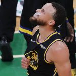 
              Golden State Warriors guard Stephen Curry (30) reacts during the fourth quarter of Game 3 of basketball's NBA Finals against the Boston Celtics, Wednesday, June 8, 2022, in Boston. (AP Photo/Michael Dwyer)
            
