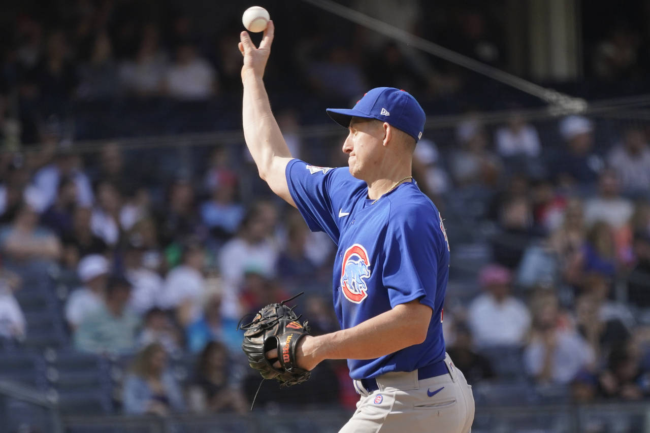 Chicago Cubs first baseman Frank Schwindel pitches in the eighth inning of a baseball game against ...