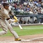 
              San Diego Padres' Manny Machado hits a three-run home run during the fourth inning of a baseball game against the Milwaukee Brewers Friday, June 3, 2022, in Milwaukee. (AP Photo/Morry Gash)
            