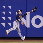
              Milwaukee Brewers' Christian Yelich catches a ball hit by New York Mets' Tomas Nido for an out during the fourth inning of a baseball game, Tuesday, June 14, 2022, in New York. (AP Photo/Frank Franklin II)
            