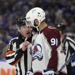 
              Referee Kelly Sutherland talks to Colorado Avalanche center Nazem Kadri during the second period of Game 6 of the NHL hockey Stanley Cup Finals against the Tampa Bay Lightning on Sunday, June 26, 2022, in Tampa, Fla. (AP Photo/Phelan Ebenhack)
            