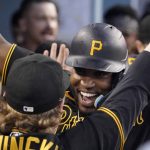 
              Pittsburgh Pirates' Rodolfo Castro, right, is congratulated by teammate Jack Suwinski in the dugout after hitting a two-run home run during the eighth inning of a baseball game against the Los Angeles Dodgers Wednesday, June 1, 2022, in Los Angeles. (AP Photo/Mark J. Terrill)
            