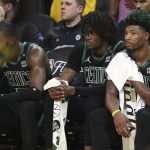 
              Boston Celtics' Jaylen Brown, from left, sits on the bench with Robert Williams III and Marcus Smart during the second half of Game 5 of basketball's NBA Finals against the Golden State Warriors in San Francisco, Monday, June 13, 2022. (AP Photo/Jed Jacobsohn)
            
