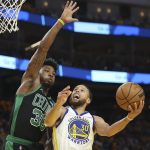 
              Golden State Warriors guard Stephen Curry (30) shoots against Boston Celtics guard Marcus Smart during the second half of Game 5 of basketball's NBA Finals in San Francisco, Monday, June 13, 2022. (AP Photo/Jed Jacobsohn)
            