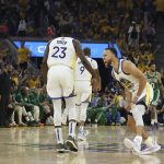 
              Golden State Warriors guard Stephen Curry, right, celebrates with forward Draymond Green (23) during the first half of Game 1 of basketball's NBA Finals against the Boston Celtics in San Francisco, Thursday, June 2, 2022. (AP Photo/Jed Jacobsohn)
            