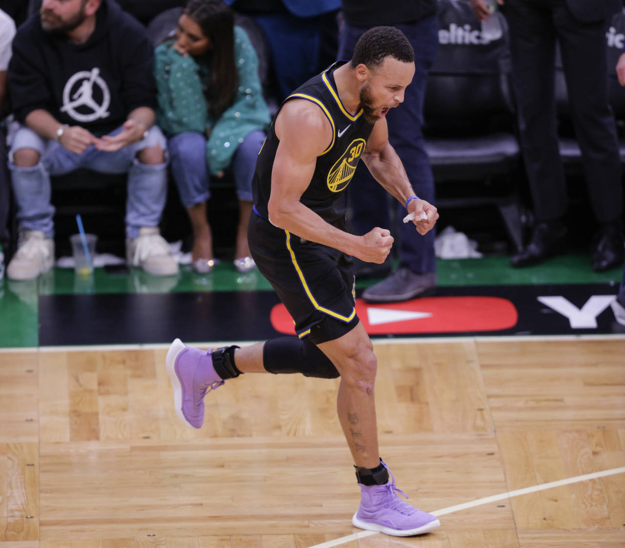 Golden State Warriors' Stephen Curry, 30, reacts after hitting a three pointer during the fourth qu...