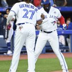
              Toronto Blue Jays first baseman Vladimir Guerrero Jr (27) and Teoscar Hernandez, right, celebrate a two-run home run by Hernandez against the Chicago White Sox in the sixth inning of a baseball game in Toronto, Thursday, June 2, 2022. (Jon Blacker/The Canadian Press via AP)
            