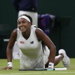 
              Coco Gauff of the US falls as she tries to make a return to Romania's Mihaela Buzarnescu in a second round women's singles match on day four of the Wimbledon tennis championships in London, Thursday, June 30, 2022. (AP Photo/Kirsty Wigglesworth)
            
