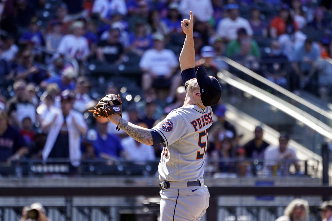 Houston Astros relief pitcher Ryan Pressly reacts after striking out New York Mets' Francisco Lindo...