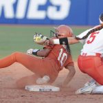 
              Texas' Mia Scott (10) steals second base before Oklahoma State infielder Kiley Naomi (5) can make the tag during the sixth inning of an NCAA softball Women's College World Series game on Monday, June 6, 2022, in Oklahoma City. (AP Photo/Alonzo Adams)
            