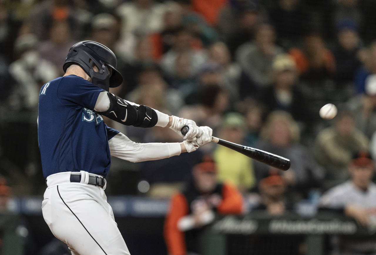 Seattle Mariners' Jessie Winker hits a two-run double off Baltimore Orioles relief pitcher Felix Ba...