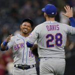 
              New York Mets third baseman Eduardo Escobar, left, celebrates with teammate first baseman J.D. Davis after the Mets defeated the San Diego Padres 11-5 in a baseball game Monday, June 6, 2022, in San Diego. (AP Photo/Gregory Bull)
            