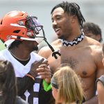 
              Cleveland Browns cornerback A.J. Green, left, and defensive end Myles Garrett laugh while signing autographs after an NFL football practice at the team's training facility, Wednesday, June 1, 2022, in Berea, Ohio. (AP Photo/David Richard)
            
