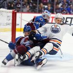 
              Colorado Avalanche defenseman Jack Johnson (3) pulls down Edmonton Oilers right wing Jesse Puljujarvi (13) during the first period in Game 2 of the NHL hockey Stanley Cup playoffs Western Conference finals Thursday, June 2, 2022, in Denver. (AP Photo/Jack Dempsey)
            